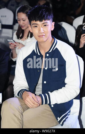 --FILE--Taiwanese actor Kai Ko smiles during a product publicity for men's skin care products in Shanghai, China, 15 April 2014.   Taiwanese actor Kai Stock Photo