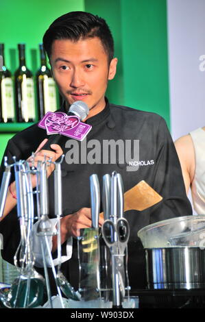 Hong Kong singer and actor Nicholas Tse speaks at a promotional event for Olivoila olive oil in Hangzhou city, east Chinas Zhejiang province, 24 Augus Stock Photo