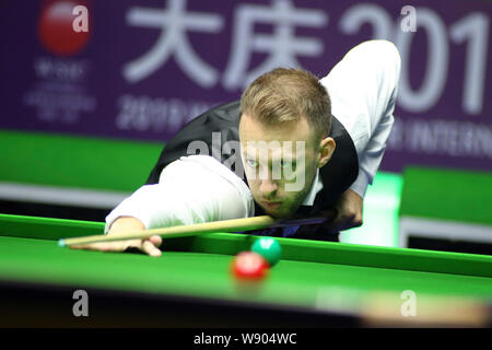 Judd Trump of England plays a shot to Tom Ford of England in their quarterfinal match during the 2019 World Snooker International Championship in Daqing city, northeast China's Heilongjiang province, 8 August 2019. Stock Photo