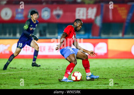 Cameroonian football player Christian Bassogog of Henan Jianye dribbles against Beijing Renhe in their 23rd round match during the 2019 Chinese Football Association Super League (CSL) in Zhengzhou city, central China's Henan province, 9 August 2019. Henan Jianye defeated Beijing Renhe 2-1.