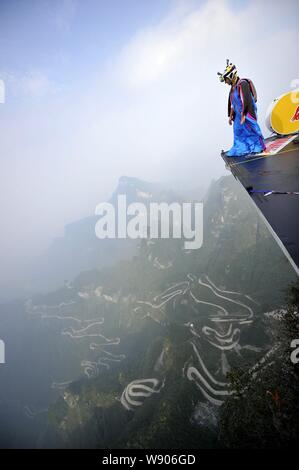 Wingsuit flier Ellen Brennan of the United States prepares to jump off a mountain during the final of the 3rd Red Bull WWL China Grand Prix on Tianmen Stock Photo