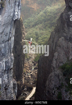 A helicopter flies through a mountain cave to film scenes during a filming session for the movie, Transformers 4: Age of Extinction, at the Three Natu Stock Photo