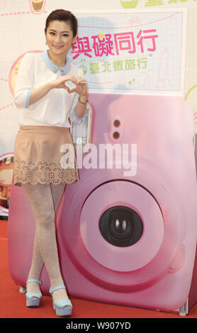 Selina Jen Chia-hsuan of Taiwanese pop girl group S.H.E poses at a press conference to promote a tourism campaign for the handicapped in Taipei, Taiwa Stock Photo