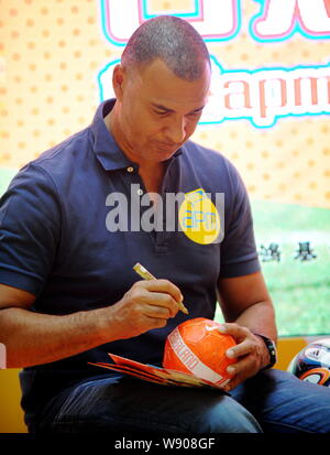 Dutch football star and manager Ruud Gullit, head coach of FC Terek Grozny, signs his autographs on a ball during a fans meeting for the upcoming 2014 Stock Photo