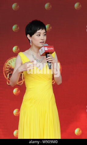 Chinese actress Sun Li speaks at the opening ceremony for Shanghai Old Temple Gold's new flagship store in Shanghai, China, 29 September 2014. Stock Photo