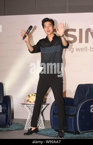 South Korean actor Lee Min Ho waves during a fan meeting in Hong Kong, China, 29 June 2014. Stock Photo