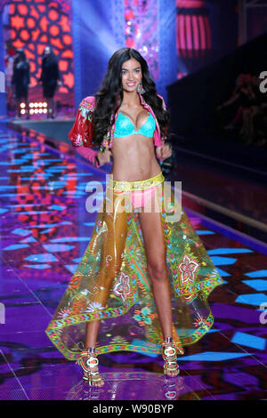 Australian model Shanina Shaik displays a new creation of Exotic Traveler collections at the 2014 Victoria's Secret Fashion Show in London, UK, 2 Dece Stock Photo