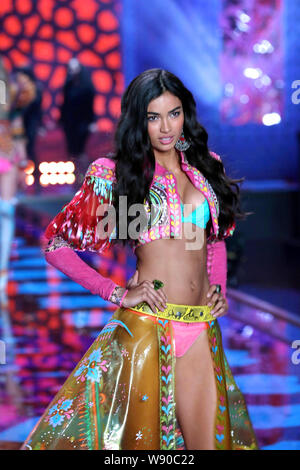 Australian model Shanina Shaik displays a new creation of Exotic Traveler collections at the 2014 Victoria's Secret Fashion Show in London, UK, 2 Dece Stock Photo