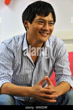 --FILE--American actor Archie David Kao smiles during an interview in Beijing, China, 23 July 2012.   The studio of Chinese actress Zhou Xun on Wednes Stock Photo