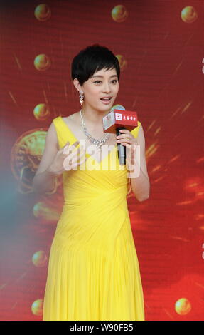 Chinese actress Sun Li speaks at the opening ceremony for Shanghai Old Temple Gold's new flagship store in Shanghai, China, 29 September 2014. Stock Photo