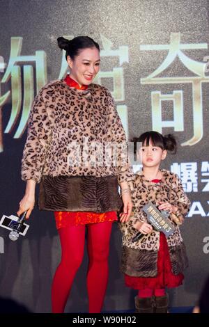 Canadian actress Christy Chung, left, smiles next to her daughter Cayla during a premiere for the movie 'Night at the Museum: Secret of the Tomb' in B Stock Photo