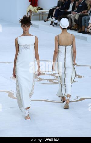 Models display new creations by Chanel at its Fall/Winter 2014 Haute Couture fashion show in Paris, France, 8 July 2014. Stock Photo