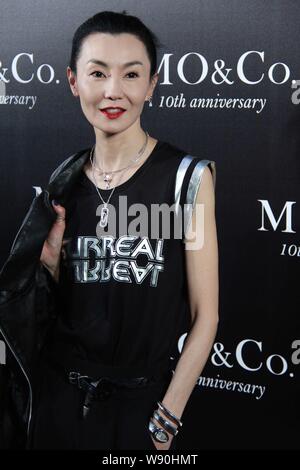 Hong Kong actress Maggie Cheung poses at a fashion event for the 10th anniversary of MO&Co. in Guangzhou city, south Chinas Guangdong province, 18 Jul Stock Photo