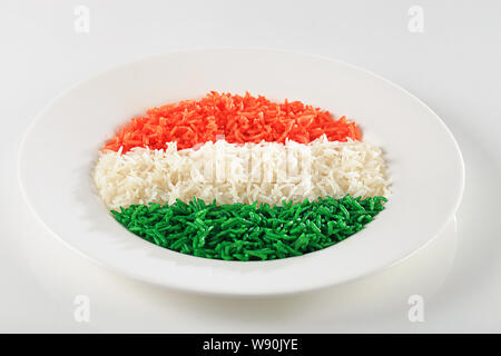 Rice served in a plate and representing Indian Flag Stock Photo