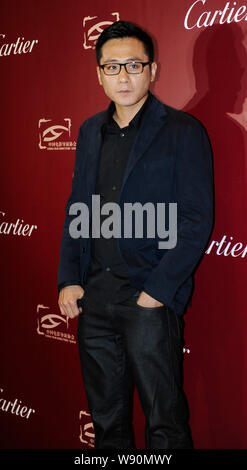 Chinese actor Liu Ye poses on the red carpet as he arrives for the nomination banquet of the 2013 China Film Directors Guide awards ceremony in Beijin Stock Photo