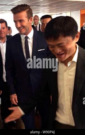 Jack Ma Yun, right, Chairman of Alibaba Group, welcomes English football star David Beckham at the headquarters of Chinese e-commerce giant Alibaba Gr Stock Photo