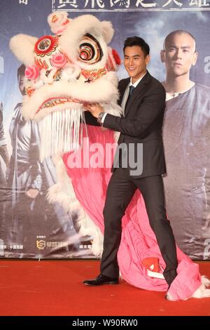 Taiwanese actor Eddie Peng poses during a press conference for his new movie 'Rise of the Legend' in Taipei, Taiwan, 27 November 2014. Stock Photo