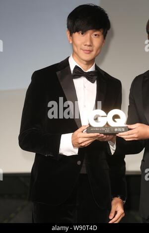 Singaporean singer JJ Lin poses during the 'GQ Men Of The Year Awards' in Taipei, Taiwan, 24 November 2014. Stock Photo