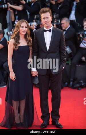 American actor Edward Norton, right, and his wife Shauna Robertson pose on the red carpet for the opening ceremony of the 71st Venice Film Festival in Stock Photo