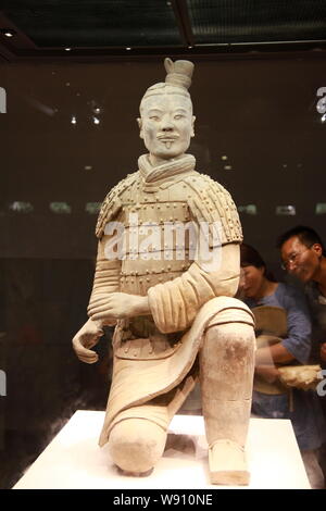 A terracotta warrior is seen exhibited at the Museum of the Terra-cotta Warriors and Horses of Qin Shihuang (The Emperor Qins Terra-cotta Warriors and Stock Photo