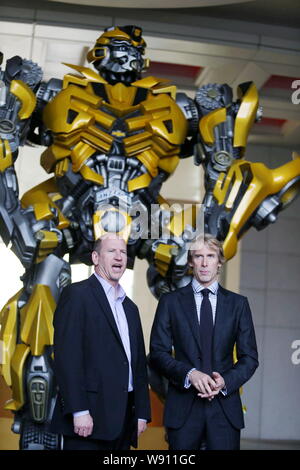 Rob Moore, left, Vice Chairman of Paramount Pictures, speaks next to American director Michael Bay at a press conference for the Beijing premiere of t Stock Photo