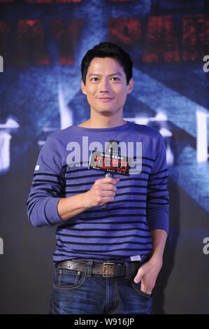 American actor Archie Kao, the husband of Chinese actress Zhou Xun, poses during a press conference for his new movie, The Deathday Party, in Beijing, Stock Photo