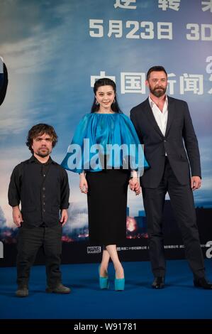 (From left) American actor Peter Dinklage, Chinese actress Fan Bingbing and Australian actor Hugh Jackman pose during a press conference for their new Stock Photo