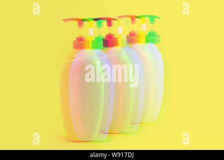 Glitch effect. Packaging bottles for cosmetics on a yellow background Stock Photo