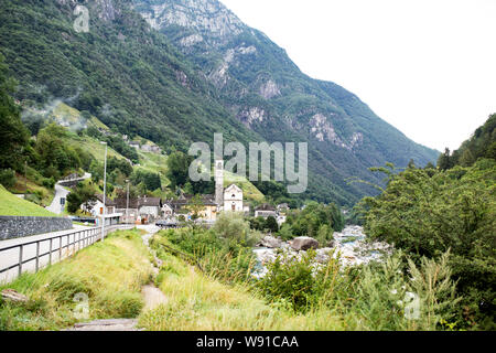 The Verzasca valley and river, looking toward the town of Lavertezzo and its church of Santa Maria Degli Angeli, in the Ticino region of Switzerland. Stock Photo