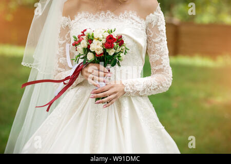 wedding bouquet in the hands of the bride close-up Stock Photo