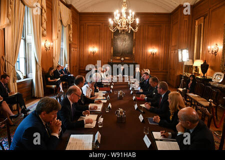 Prime Minister Boris Johnson (5th left) in Downing Street, London, during a roundtable on crime which is looking at how to improve the criminal justice system and deal with the most serious and violet offenders. Stock Photo