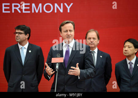 British Prime Minister David Cameron, front, speaks at a ceremony during his visit to Chengdu city, southwest Chinas Sichuan province, 4 December 2013 Stock Photo