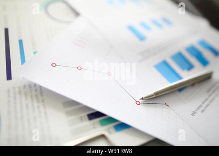 Silver pen lies on documents with Stock Photo