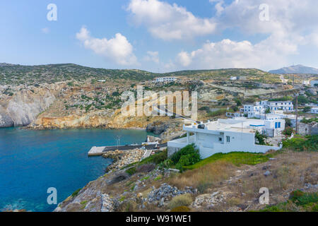 Potamos village with the port and the colorful fishing boats sailing in the turquoise sea waters in Antikythera island in Greece Stock Photo