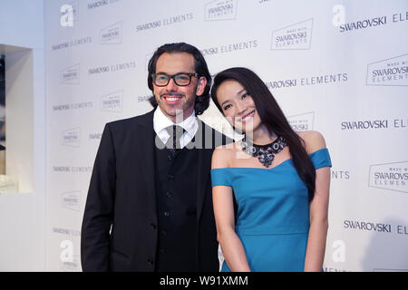 Taiwanese actress Shu Qi, right, poses with Hermann Winkler, Vice President for North Asia Operations of Swarovski Elements, during the presentation o Stock Photo