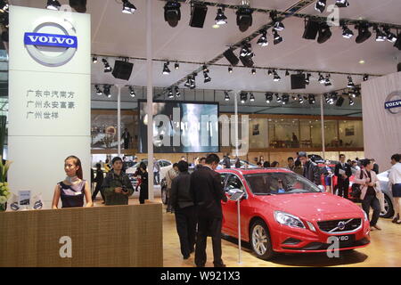 --FILE--Visitors look at a Volvo V60 during the 10th China (Guangzhou) International Automobile Exhibition, known as Auto Guangzhou 2012, in Guangzhou Stock Photo