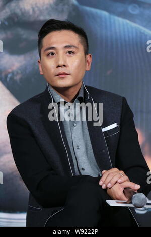 Chinese actor Liu Ye poses at a press conference for his new movie, Police Story 2013, in Beijing, China, 8 December 2013. Stock Photo