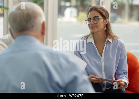 Cute young woman being on business meeting Stock Photo