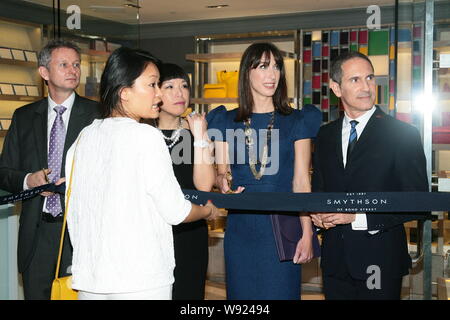 Samantha Cameron, second right, wife of British Prime Minister David Cameron, is ready to cut the ribbon at a launch ceremony for British luxury fashi Stock Photo