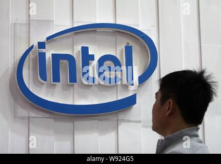 --FILE--A visitor looks at the logo of Intel during the 9th China International Optoelectronic Exposition in Wuhan city, central Chinas Hubei province Stock Photo