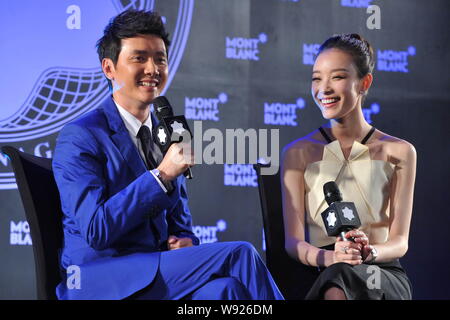 Chinese actor Feng Shaofeng, left, and his actress girlfriend Ni Ni answer a question in an interview at the 22nd Montblanc Arts Patronage Award Prese Stock Photo