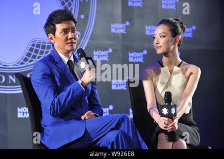 Chinese actor Feng Shaofeng, left, and his actress girlfriend Ni Ni answer a question in an interview at the 22nd Montblanc Arts Patronage Award Prese Stock Photo