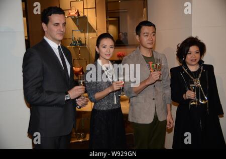Chinese actress Zhang Ziyi, second left, and actor David Tong Dawei, second right, are pictured holding champagne during the opening ceremony for a ne Stock Photo