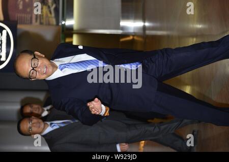 --FILE--Li Ka-shing, front, Chairman of Cheung Kong (Holdings) Limited and Chairman of Hutchison Whampoa Limited, arrives for the wedding ceremony of Stock Photo