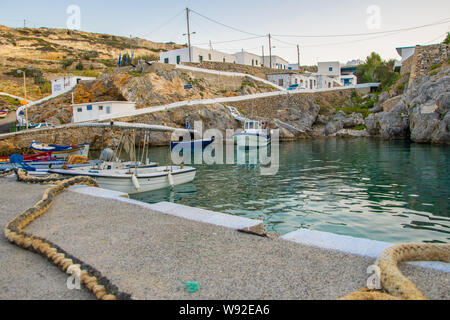 Potamos village with the port and the traditional white houses with blue windows in Antikythera island in Greece Stock Photo