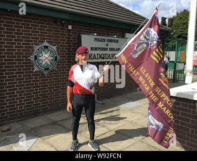 A man who declined to be named but described himself as a former member of 1 Para (1st Battalion of Parachute Regiment) holds a silent protest at policing actions in Derry on Saturday outside Police Service of Northern Ireland HQ in Belfast. Stock Photo