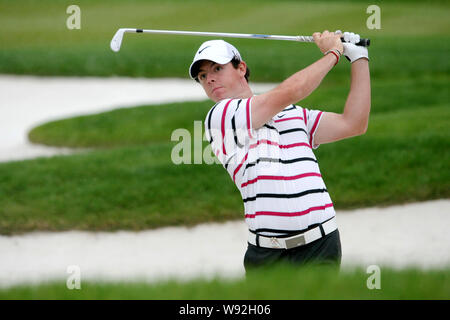 Rory McIlroy of Northern Ireland hits out of a bunker during the first round of the HSBC Champions golf tournament at the Sheshan International Golf C Stock Photo