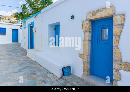 Street view of Potamos village with narrow alleys and traditional architecture in Antikythera island in Greece Stock Photo