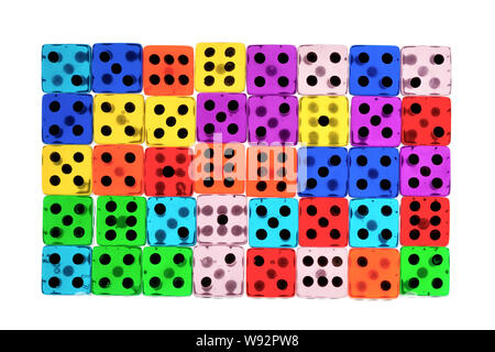 many tranlucent multicolored dices in rows, backlight, white background Stock Photo