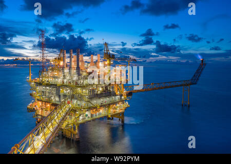 Oil and gas industry in offshore, central processing platform receive gases from wellhead platform and treat then sent to onshore refinery. Stock Photo